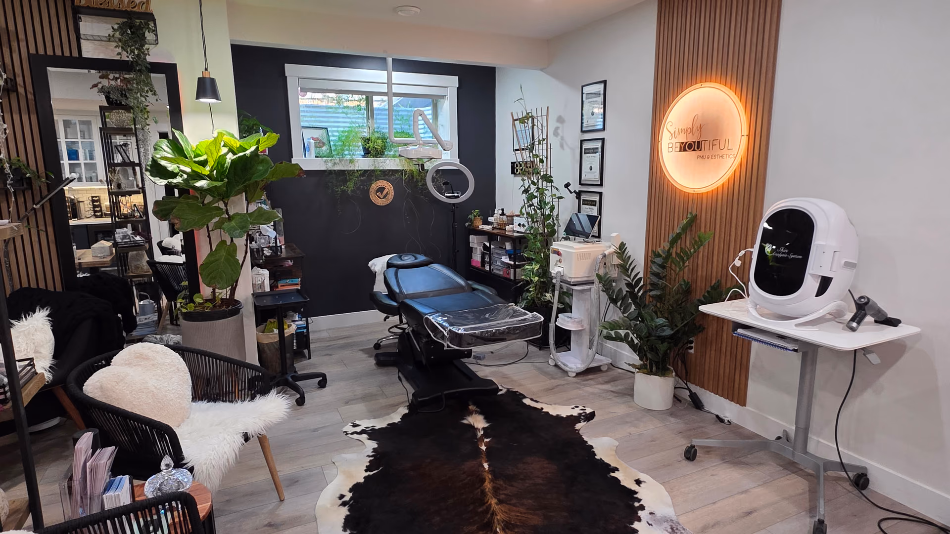 The Simply BeYOUtiful studio in St. Albert, with its lit logo sign